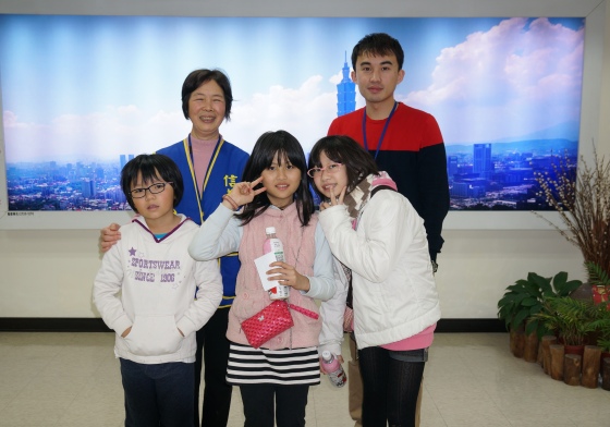 Picture with Curator of the Xinyi Public Assembly Hall and Aunt Luo at Xinyi District Office 